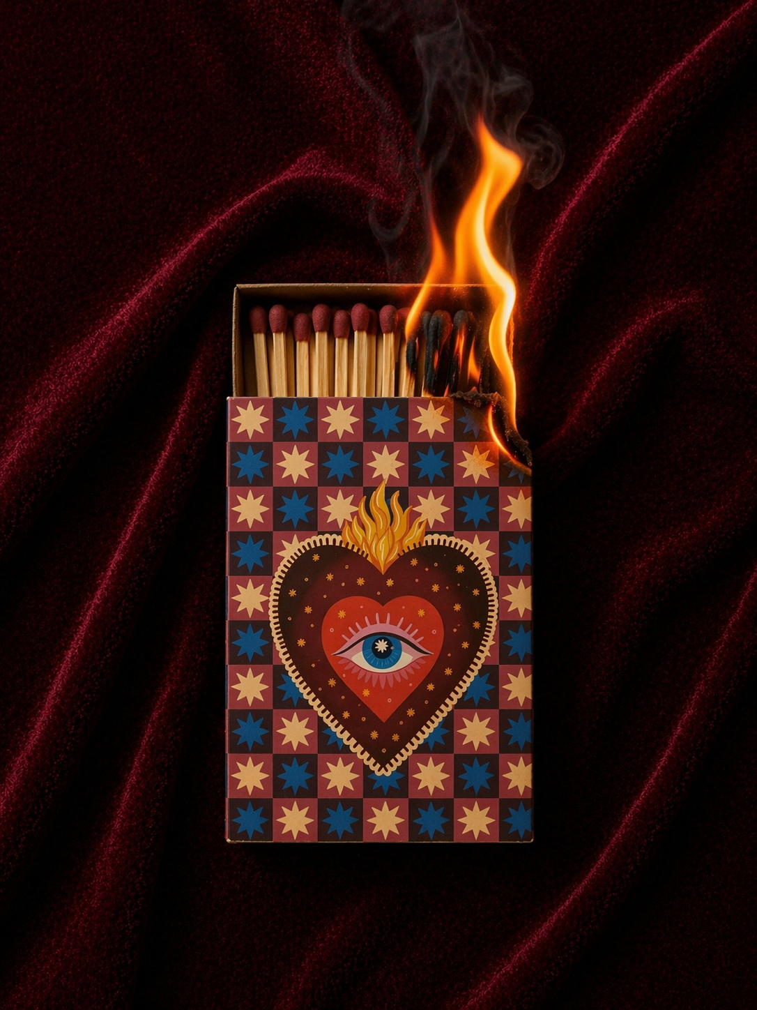 Flaming match above a patterned Miss Sparkle matchbox