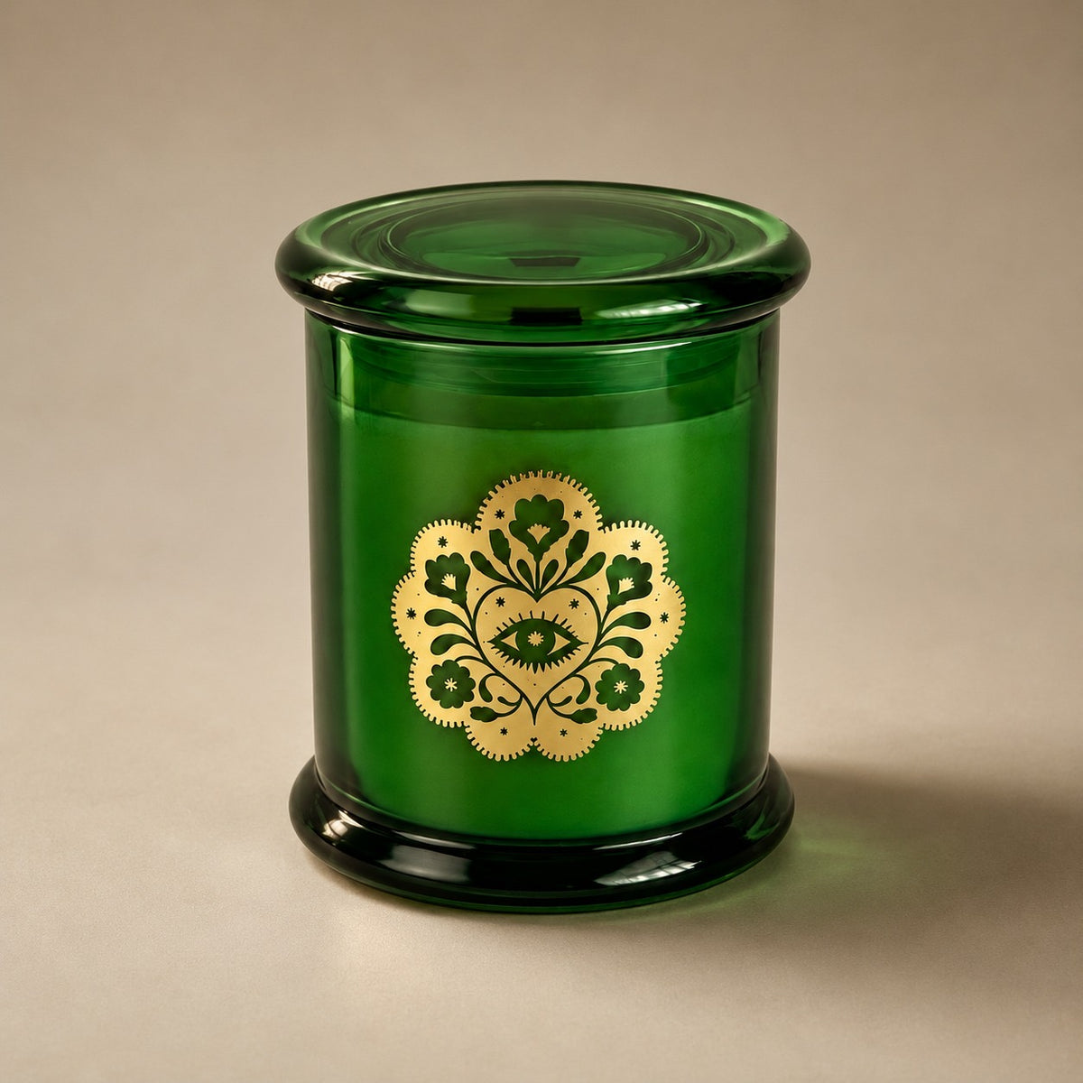 Miss Sparkle soy candle in a green glass vessel with its lid on